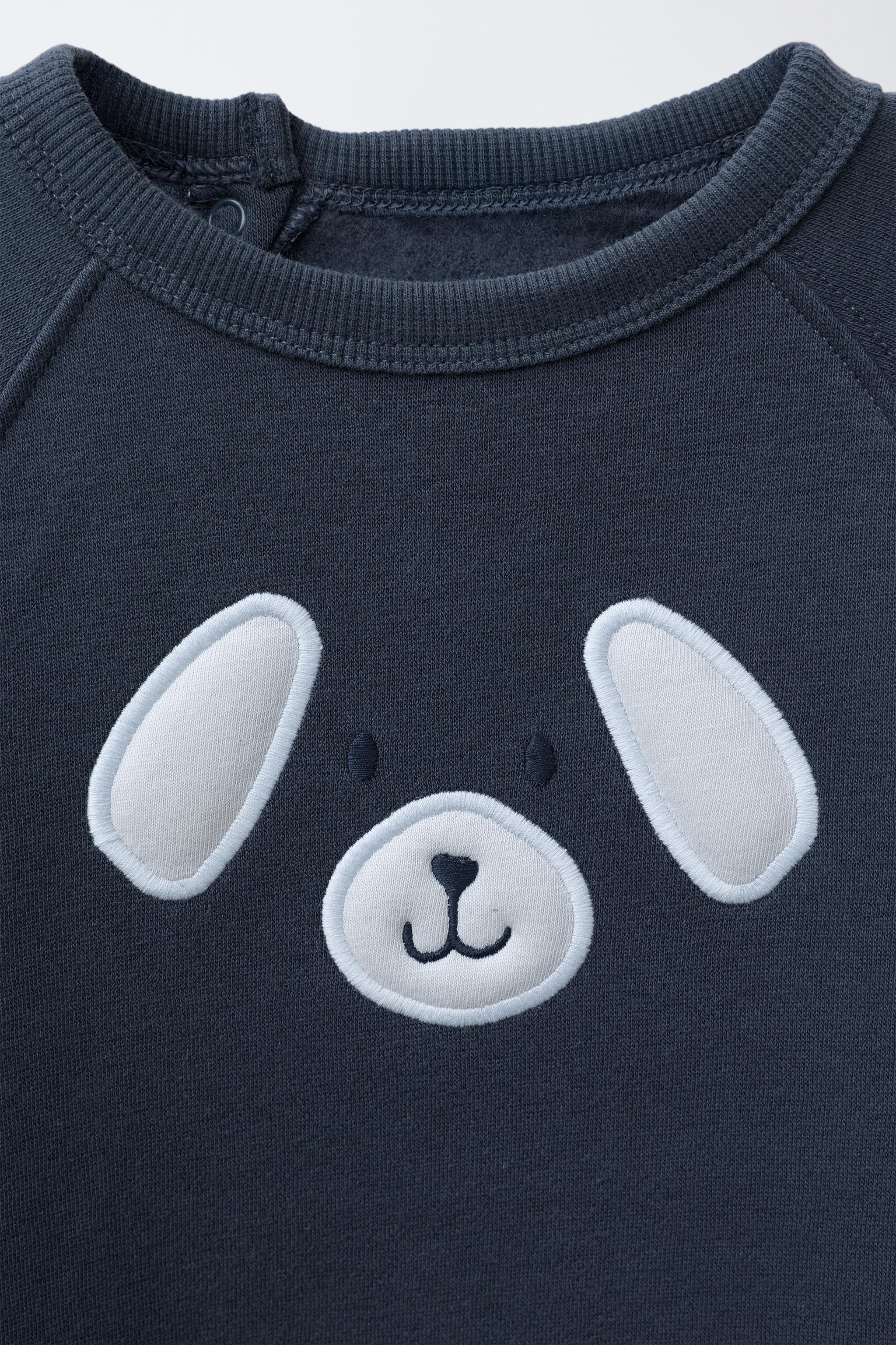 COMBINAISON EN MOLLETON À BRODERIE CHIEN